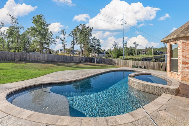 view of swimming pool with an in ground hot tub and a lawn