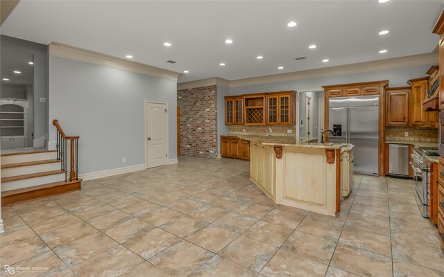 unfurnished living room with ornamental molding and hardwood / wood-style flooring