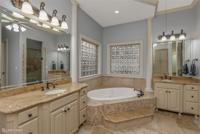 bathroom with ceiling fan, vanity, plus walk in shower, and ornate columns