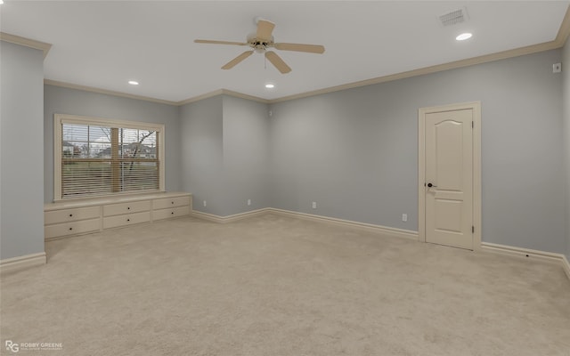 unfurnished room featuring light carpet, crown molding, and ceiling fan