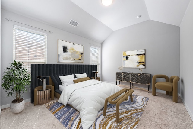 carpeted bedroom featuring multiple windows and vaulted ceiling