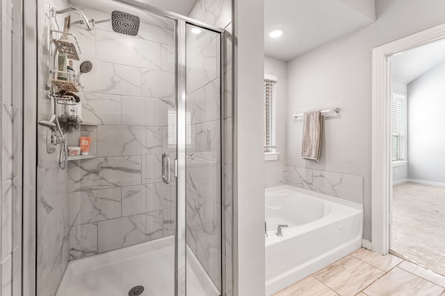 bathroom with plus walk in shower and tile patterned flooring