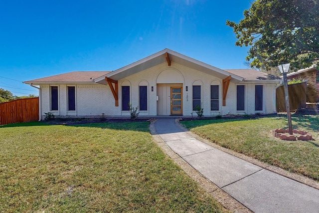 ranch-style home with a front yard