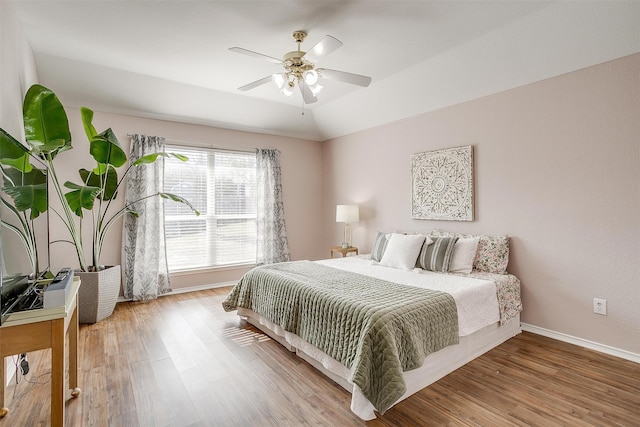 bedroom featuring hardwood / wood-style flooring and ceiling fan