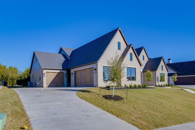 view of front facade featuring a garage and a front lawn