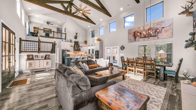 living room featuring ceiling fan, beam ceiling, french doors, and high vaulted ceiling