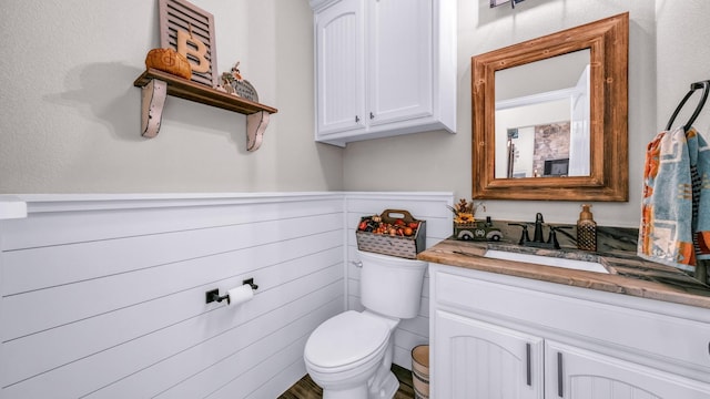 bathroom with toilet and vanity