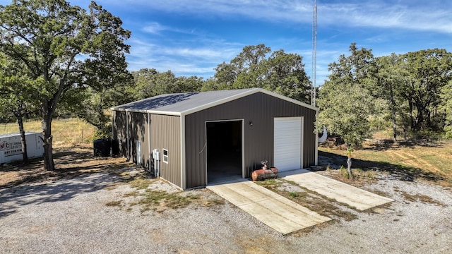 view of outbuilding with a garage