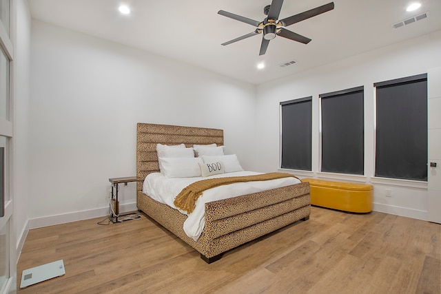 bedroom with hardwood / wood-style floors and ceiling fan