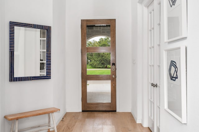 foyer entrance with light hardwood / wood-style flooring