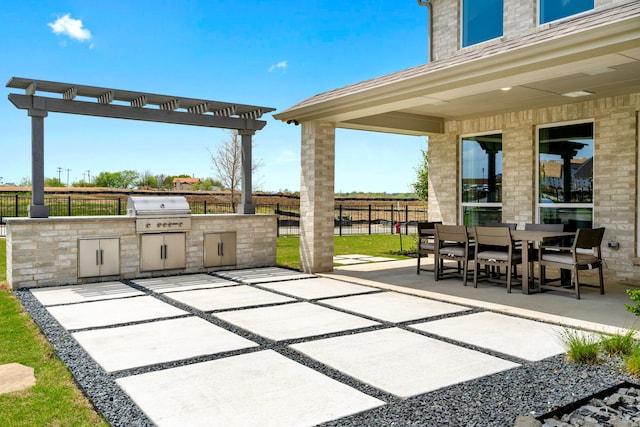 view of patio / terrace featuring a grill and exterior kitchen