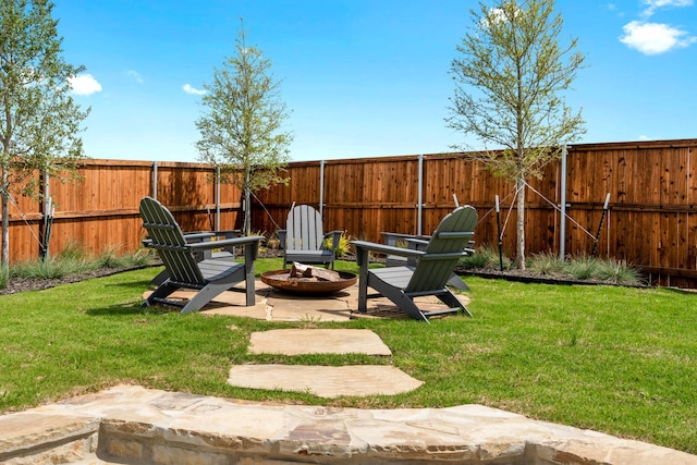 view of yard with a patio area and a fire pit