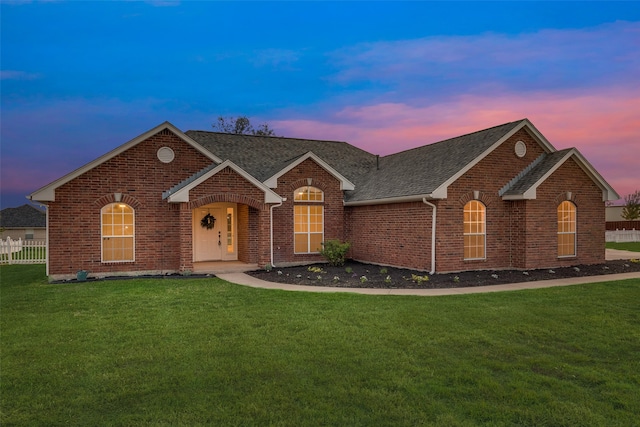 view of front of house with a yard