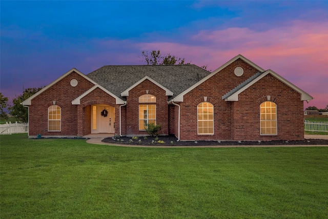 view of front of property with a yard