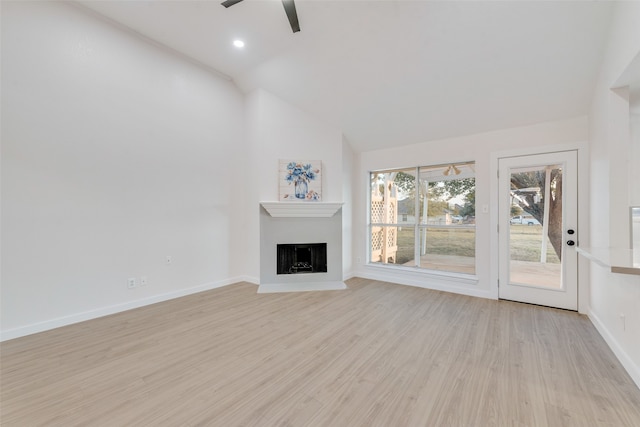 unfurnished living room with high vaulted ceiling, light wood-type flooring, and ceiling fan