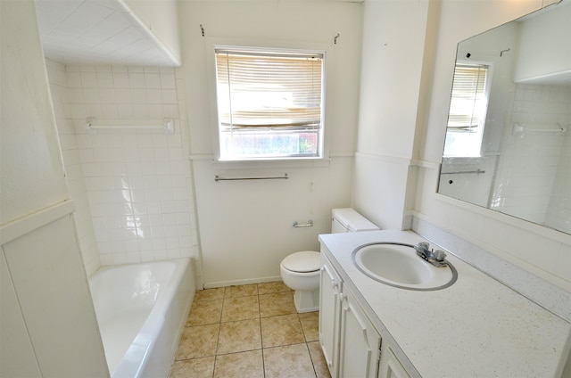 full bathroom with toilet, vanity, tile patterned floors, and a wealth of natural light