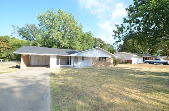 ranch-style home featuring a front yard