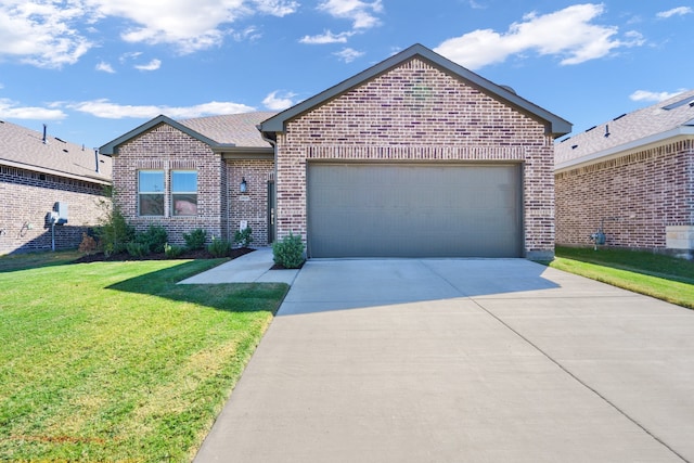 view of front of home featuring a front yard and a garage