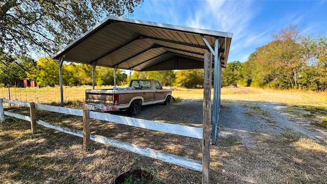 view of parking / parking lot featuring a carport