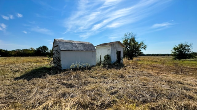 view of outdoor structure featuring a rural view