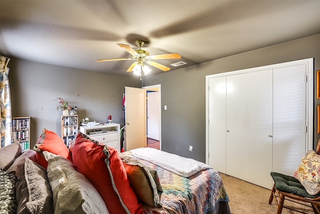 bedroom featuring ceiling fan and light colored carpet