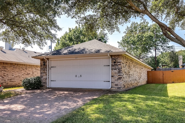 garage featuring a yard