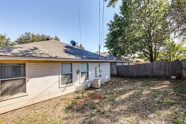 rear view of house with cooling unit