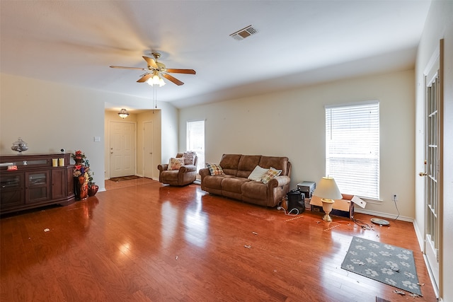 living room featuring hardwood / wood-style floors and ceiling fan