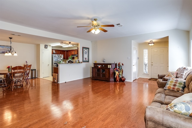 living room featuring light wood-type flooring and ceiling fan