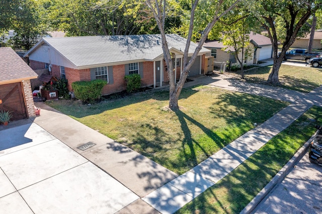 ranch-style home with a front lawn and a garage