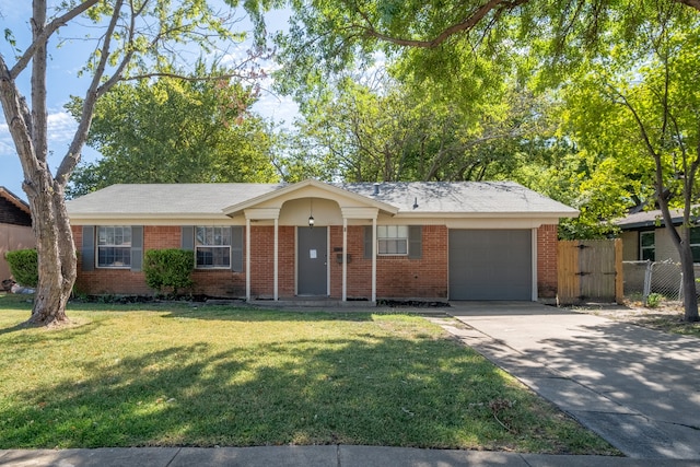 ranch-style home with a garage and a front lawn