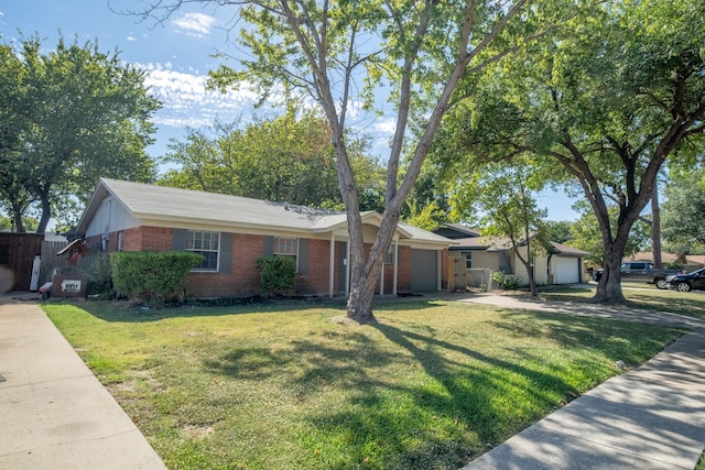 ranch-style house with a front yard and a garage