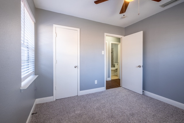 unfurnished bedroom featuring carpet flooring and ceiling fan