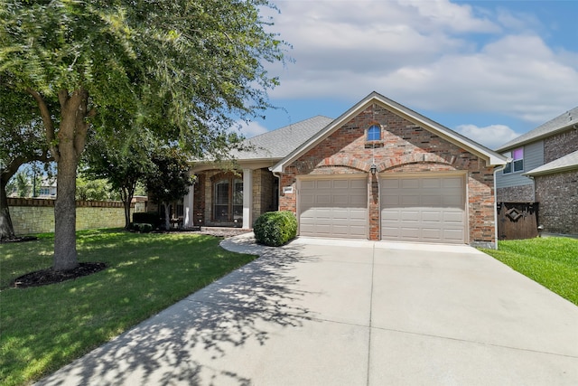 view of front of home featuring a front lawn and a garage