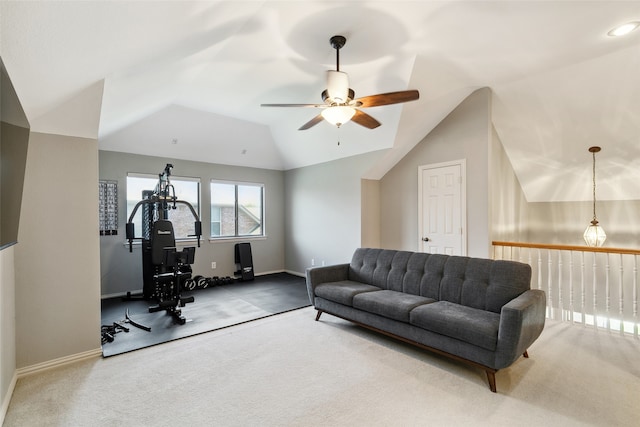 workout room featuring carpet floors, ceiling fan, and vaulted ceiling