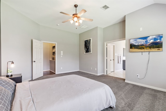 carpeted bedroom featuring vaulted ceiling and ceiling fan