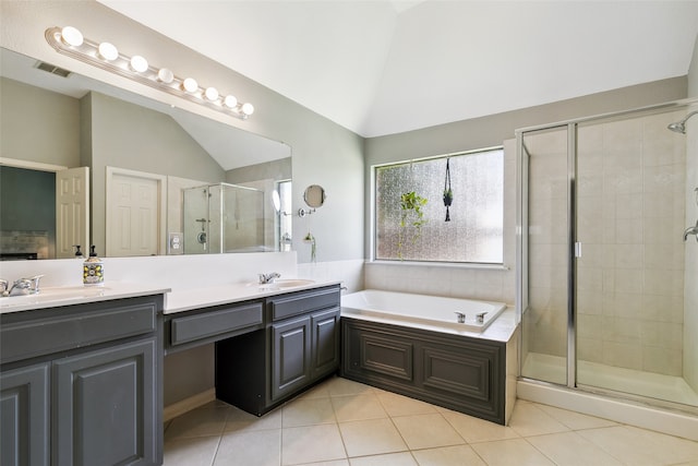 bathroom with vanity, tile patterned floors, independent shower and bath, and lofted ceiling