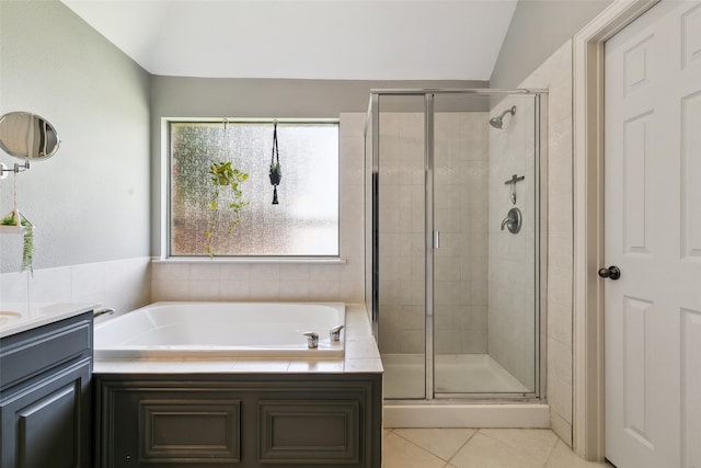 bathroom with vanity, tile patterned flooring, plus walk in shower, and vaulted ceiling