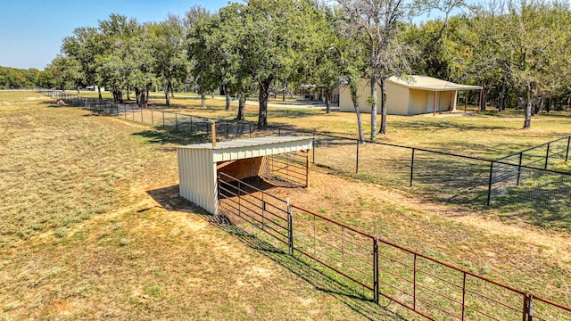 surrounding community with a rural view and an outbuilding