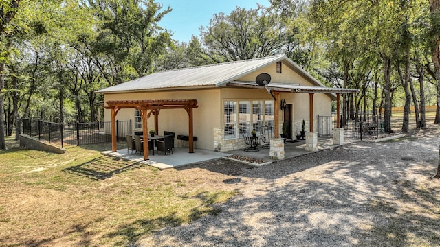 exterior space with a patio and a lawn