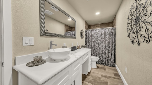 bathroom featuring vanity, wood-type flooring, toilet, and walk in shower