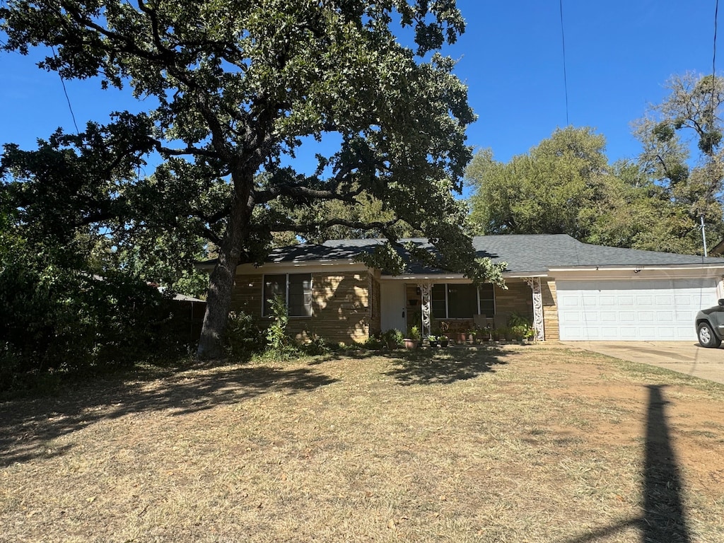 ranch-style house featuring a garage