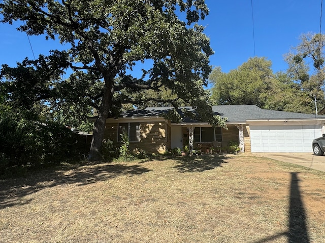 ranch-style house featuring a garage