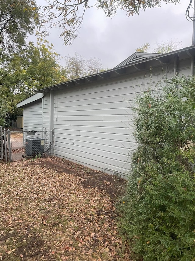 view of side of home featuring cooling unit