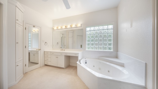 bathroom with vanity, ceiling fan, and plus walk in shower