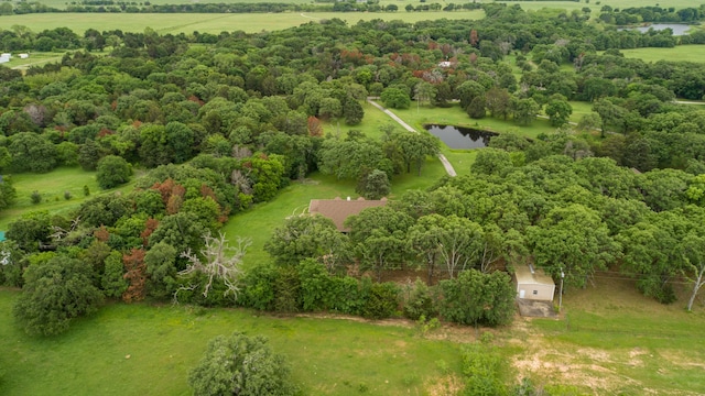 birds eye view of property with a water view and a rural view