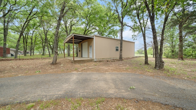 view of home's exterior featuring a carport