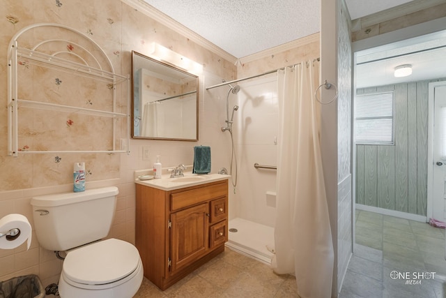 bathroom with walk in shower, a textured ceiling, toilet, vanity, and ornamental molding