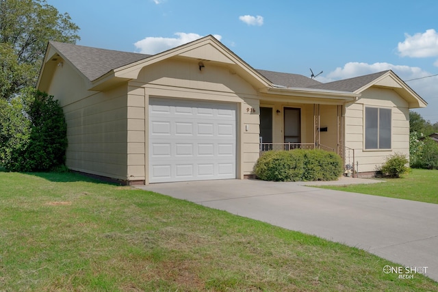 single story home with covered porch, a garage, and a front lawn