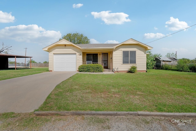 view of front of home featuring a carport, a garage, and a front yard